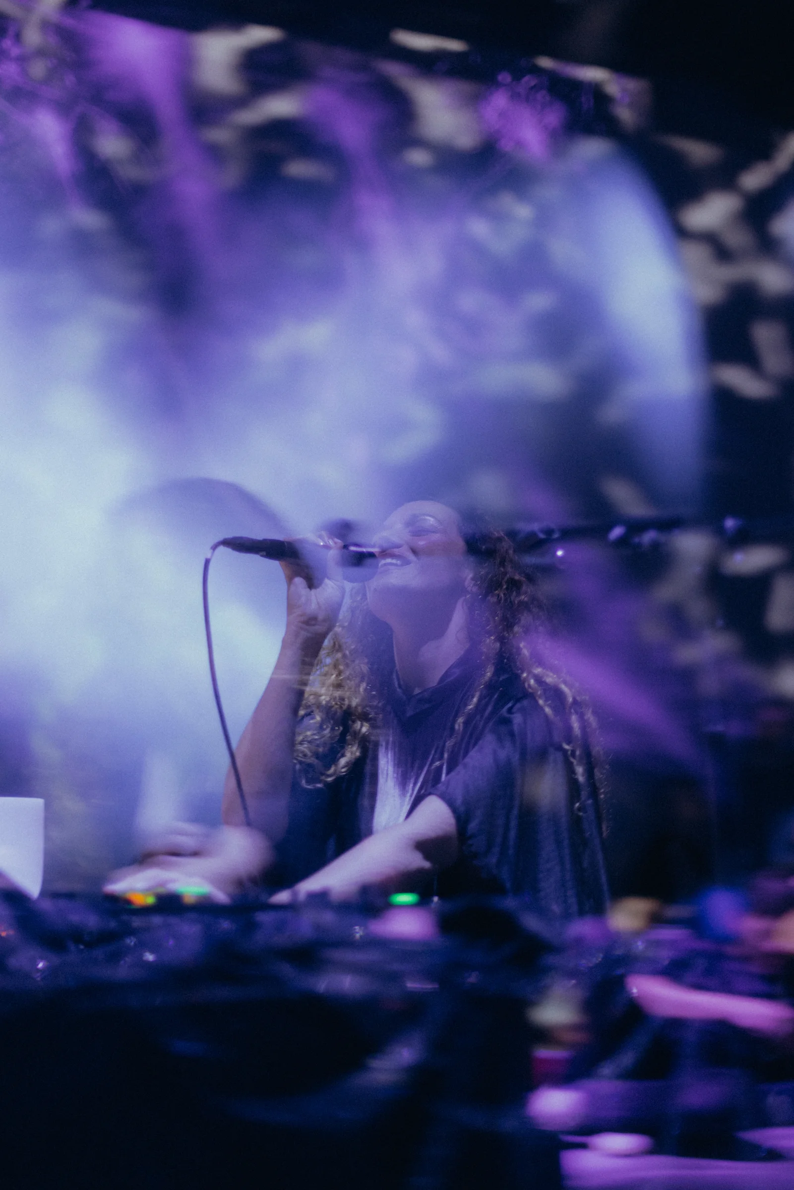 Ilhem performing within the immersive visuals of Echoes of Eurydice