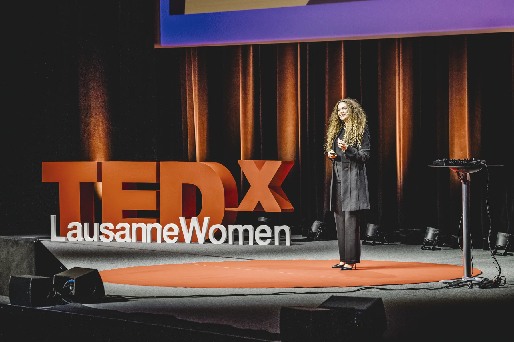 Ilhem speaking at TEDxWomen Lausanne