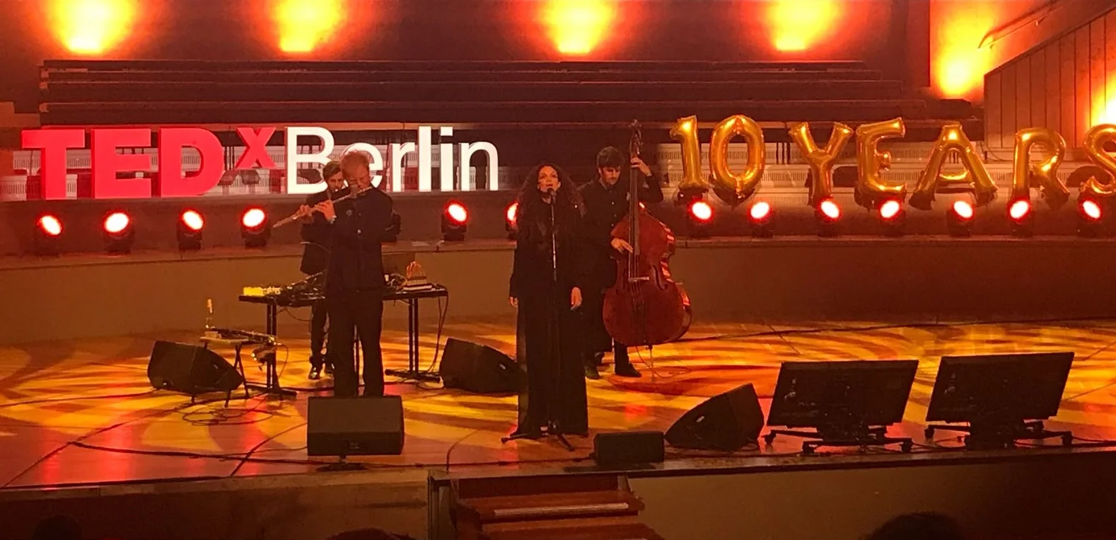 Ilhem and the live band performing at TEDx Berlin